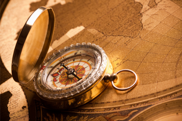 old compass on an old map