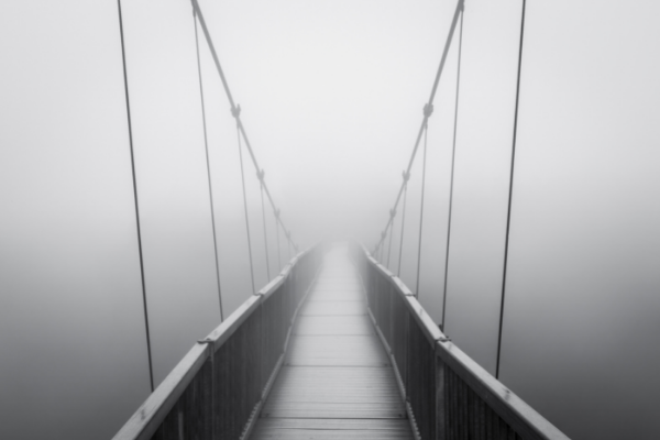 drawbridge that fades into fog